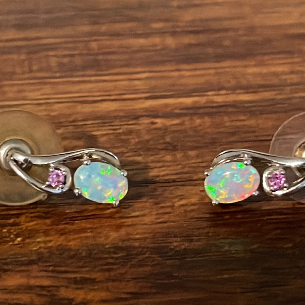 Opal ear rings with pink stud.